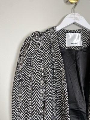 Co' Couture str. S <br/> sort og hvid cardigan med puff skuldre